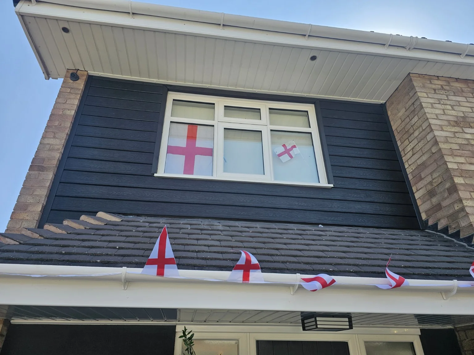 Anthracite cladding exterior with England flags